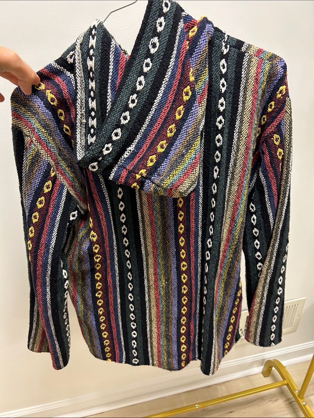 a colorful woven Baja hoodie featuring a striped pattern and a front pocket image 3